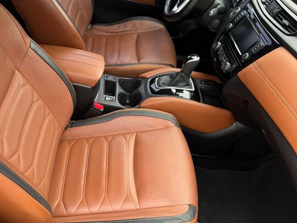 Detailed tan leather front seats and dashboard in an SUV